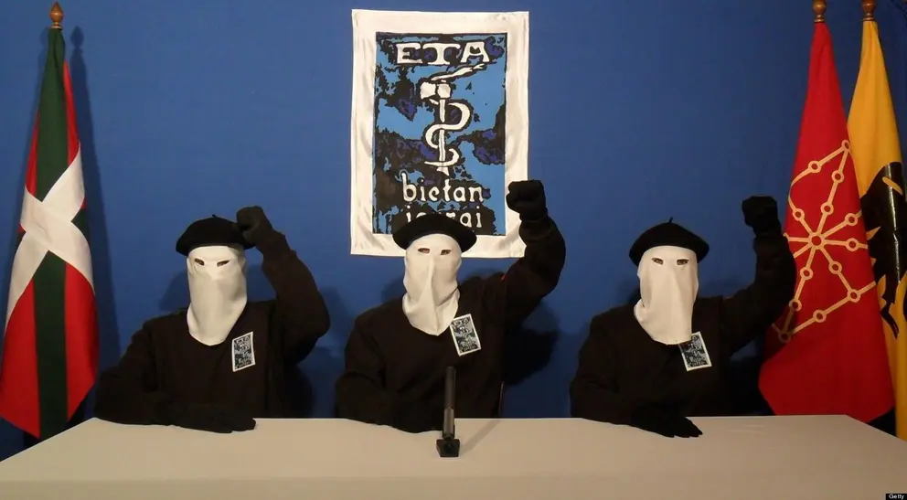 UNSPECIFIED - UNDATED:  In this undated image provided by Gara, three Eta militants pose in front of the group's symbol of a snake coiled around an axe, in support of a declaration released on October 20, 2011 stating a "definitive cessation" to it's four decade long campaign of armed conflict in seeking an independent Basque homeland from Spain and France.  (Photo released by Gara via Getty Images)