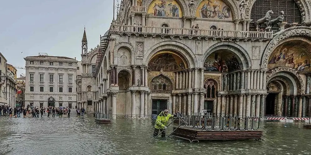 VENICE, ITALY - OCTOBER 29: Town hall workers remove wooden boards on October 29, 2018 in Venice, Italy. Due to the exceptional level of the "acqua alta" or "High Tide" that reached 156 cm today, Venetian schools and hospitals were closed by the authorities, and citizens were advised against leaving their homes . (Photo by Stefano Mazzola/Awakening/Getty Images)