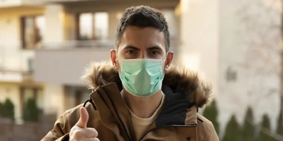 Man wearing hygienic mask to prevent the virus PM2.5 and Coronavirus. People in masks The outbreak of Novel Corona virus (2019-nCoV) in Wuhan China. air pollution, Environmental awareness concept.