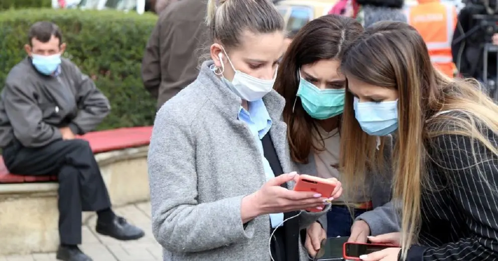 Tirana (Albania), 09/03/2020.- A group of women look at their smart phones outside the infected section in the center hospital in Tirana, Albania, 09 March 2020.Albanian authorities have secured the infection section in the general hospitals and closed every social activities in the country after they discovered the first two cases of patients infected with Covid-19. EFE/EPA/Malton Dibra