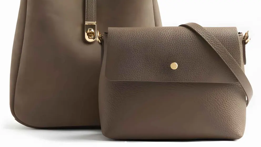 Bolso de hombro de piel con neceser extra&iacute;ble y cierre de bot&oacute;n en liso de Parfois