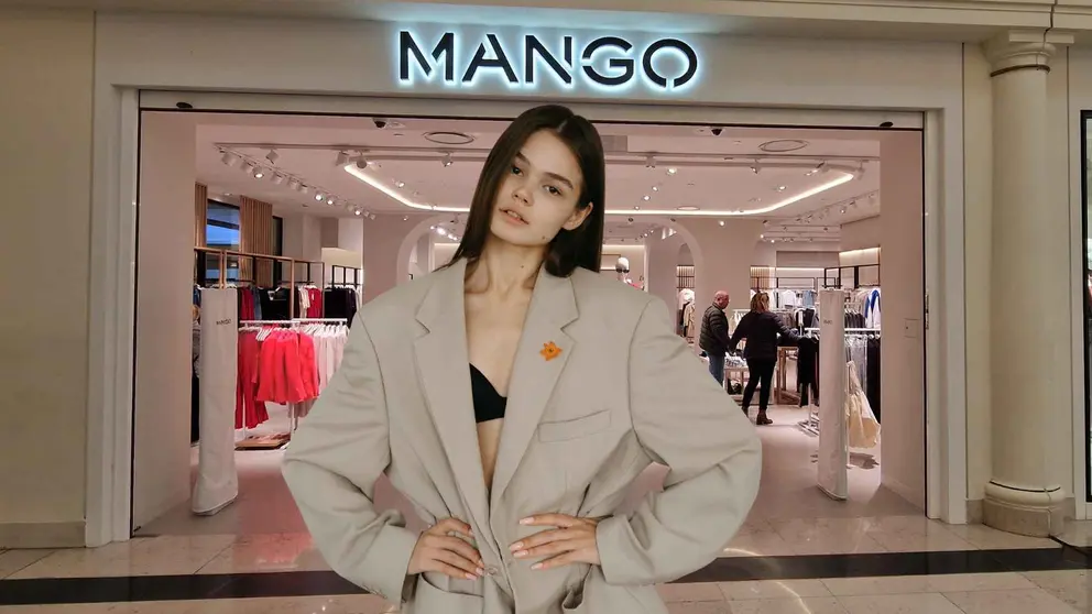 Una mujer a la moda frente a una tienda de Mango