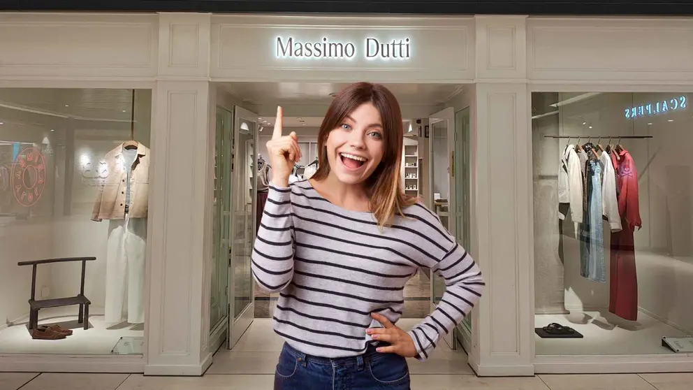 Una mujer a la moda frente a una tienda Massimo Dutti