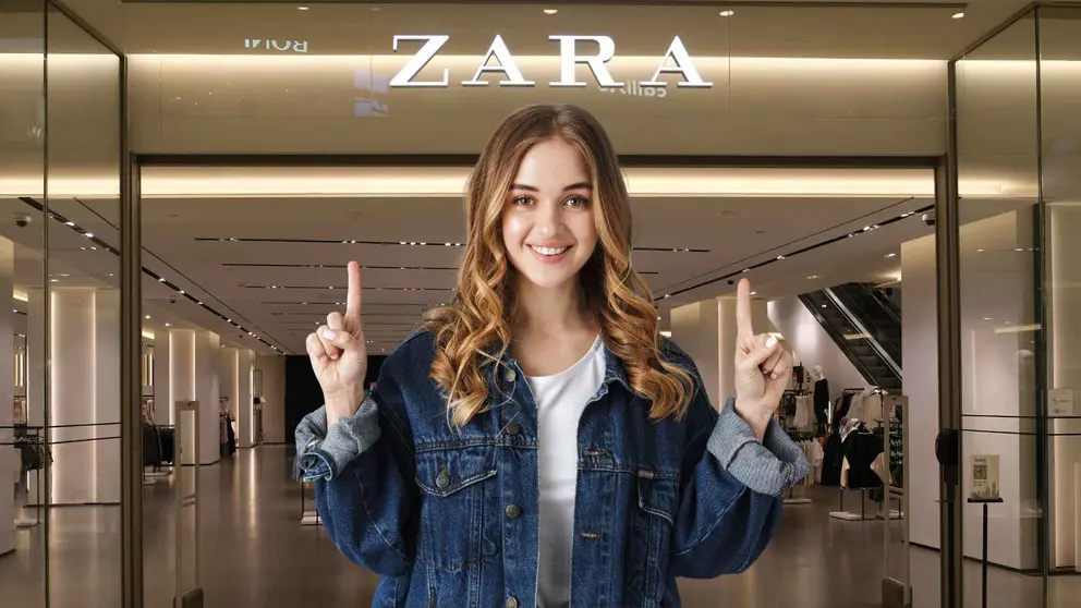 Una mujer a la moda frente a una tienda de Zara