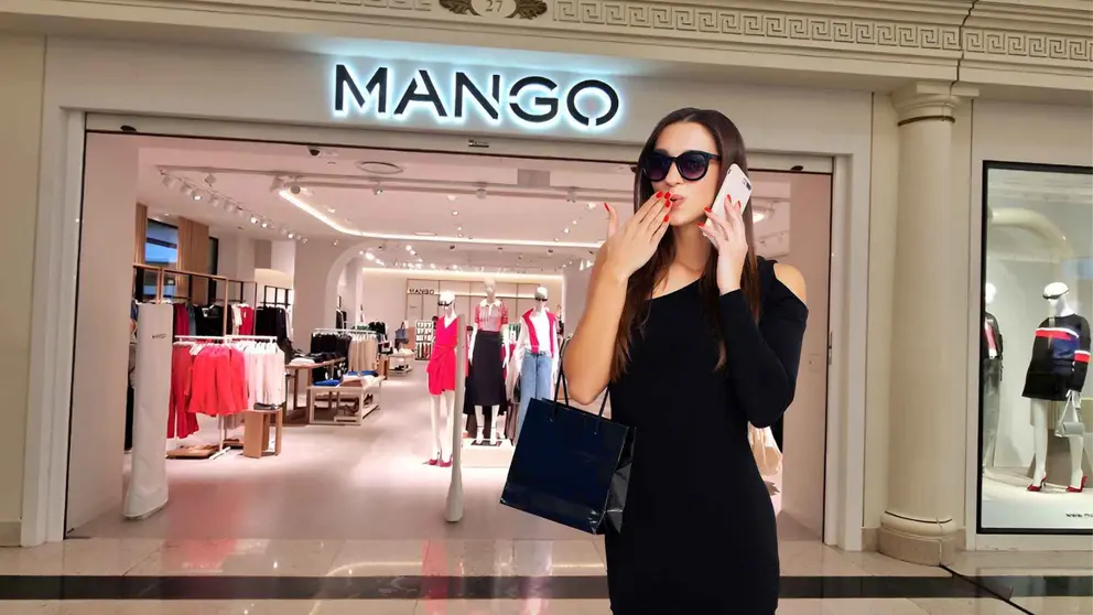 Una mujer a la moda frente a una tienda de Mango