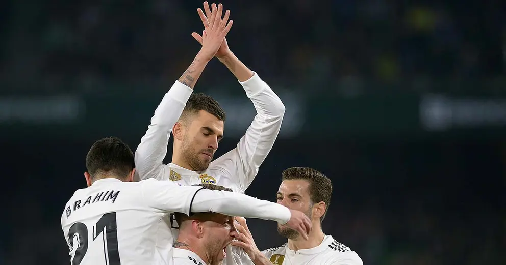 Real Madrid's Spanish midfielder Daniel Ceballos (C) celebrates after scoring a goal during the Spanish League football match between Real Betis and Real Madrid CF at the Benito Villamarin stadium in Seville on January 13, 2019. (Photo by CRISTINA QUICLER / AFP)        (Photo credit should read CRISTINA QUICLER/AFP/Getty Images)