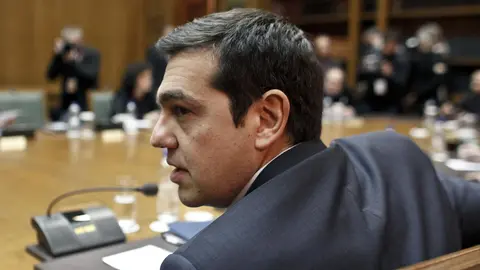 Greek Prime Minister Alexis Tsipras attends a cabinet meeting at the parliament building in Athens, February 21, 2015. Tsipras declared victory on Saturday after agreeing a last-minute conditional financial rescue deal with Europe, despite making big concessions to avert financial collapse within days. REUTERS/Kostas Tsironis  (GREECE - Tags: BUSINESS POLITICS HEADSHOT) - RTR4QJ0Q