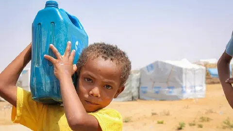 A displaced child carries a gallon of water at a displacement site in the Abs district of Hajjah governorate, where UNHCR has built 4,900 transitional shelters. ; Yemen is facing a severe protection crisis, and civilians face serious risks to their safety, well-being and basic rights. Tens of thousands of people have been killed or injured since 2015, among them at least 17,000 civilians. An estimated 3.65 million people remain displaced and escalating conflict is causing extensive damage to public and civilian infrastructure. Humanitarian needs are the most acute in governorates most affected by conflict, including Taizz, Al Hudaydah, Hajjah and Al Dhale&rsquo;e where fighting and civilian impact is recorded daily. In total, more than 22 million Yemenis are in need of aid. UNHCR provides shelter, legal and financial assistance as well as psycho-social support, and also continues to support some 280,000 refugees who remain in Yemen despite the conflict.