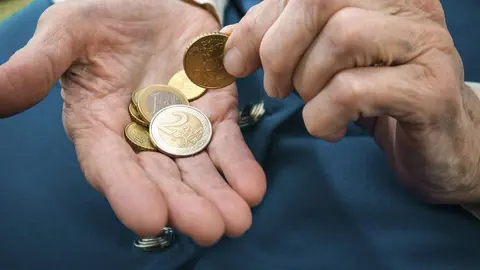Senior woman counting money