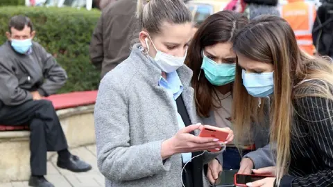 Tirana (Albania), 09/03/2020.- A group of women look at their smart phones outside the infected section in the center hospital in Tirana, Albania, 09 March 2020.Albanian authorities have secured the infection section in the general hospitals and closed every social activities in the country after they discovered the first two cases of patients infected with Covid-19. EFE/EPA/Malton Dibra