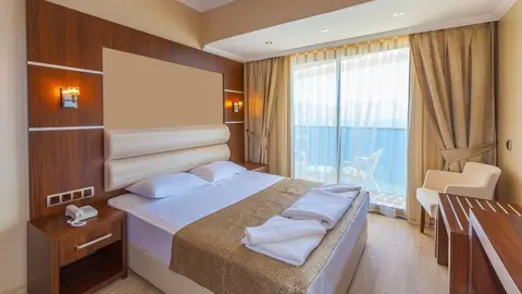 Habitaci&oacute;n de Hotel con playa al fondo