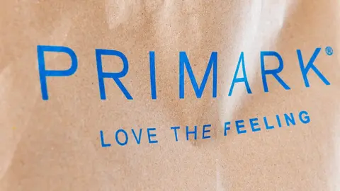 London. UK- 02.19.2023. The name of the popular fast fashion store Primark and its slogan as printed on its shopping bag.