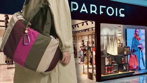 Mujer con el bolso shopper con dise&ntilde;o a rayas de Parfois