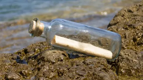 Mensaje en botella de cristal