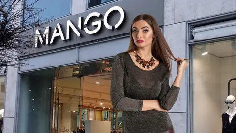 Una mujer a la moda frente a una tienda de Mango