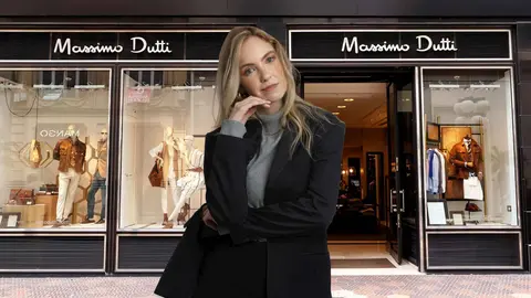 Una mujer a la moda frente a una tienda de Massimo Dutti