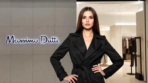 Una mujer a la moda frente a una tienda Massimo Dutti