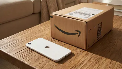 Apple iPhone 16e de 128 GB junto a una caja de Amazon