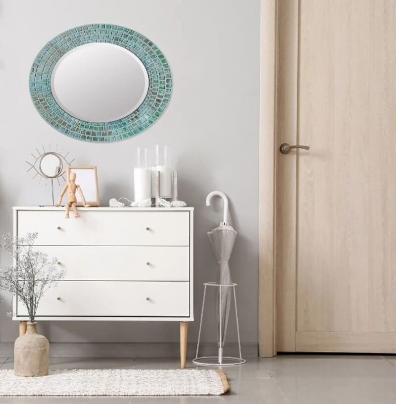 Espejo enmarcado ovalado Laser