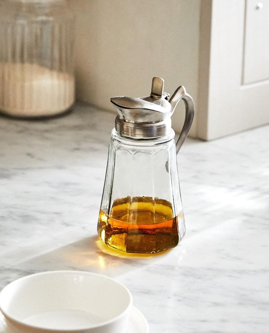 Jarra dosificadora de vidrio y acero