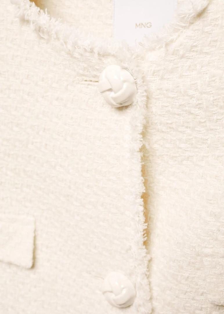 Chaqueta tweed con bolsillos de Mango