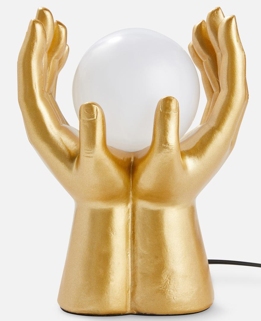 Lámpara dorada en forma de manos de Primark