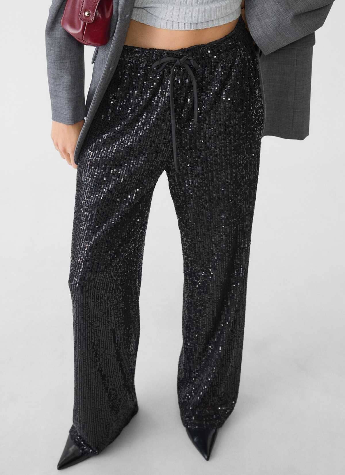 Pantalón fluido lentejuelas de Stradivarius