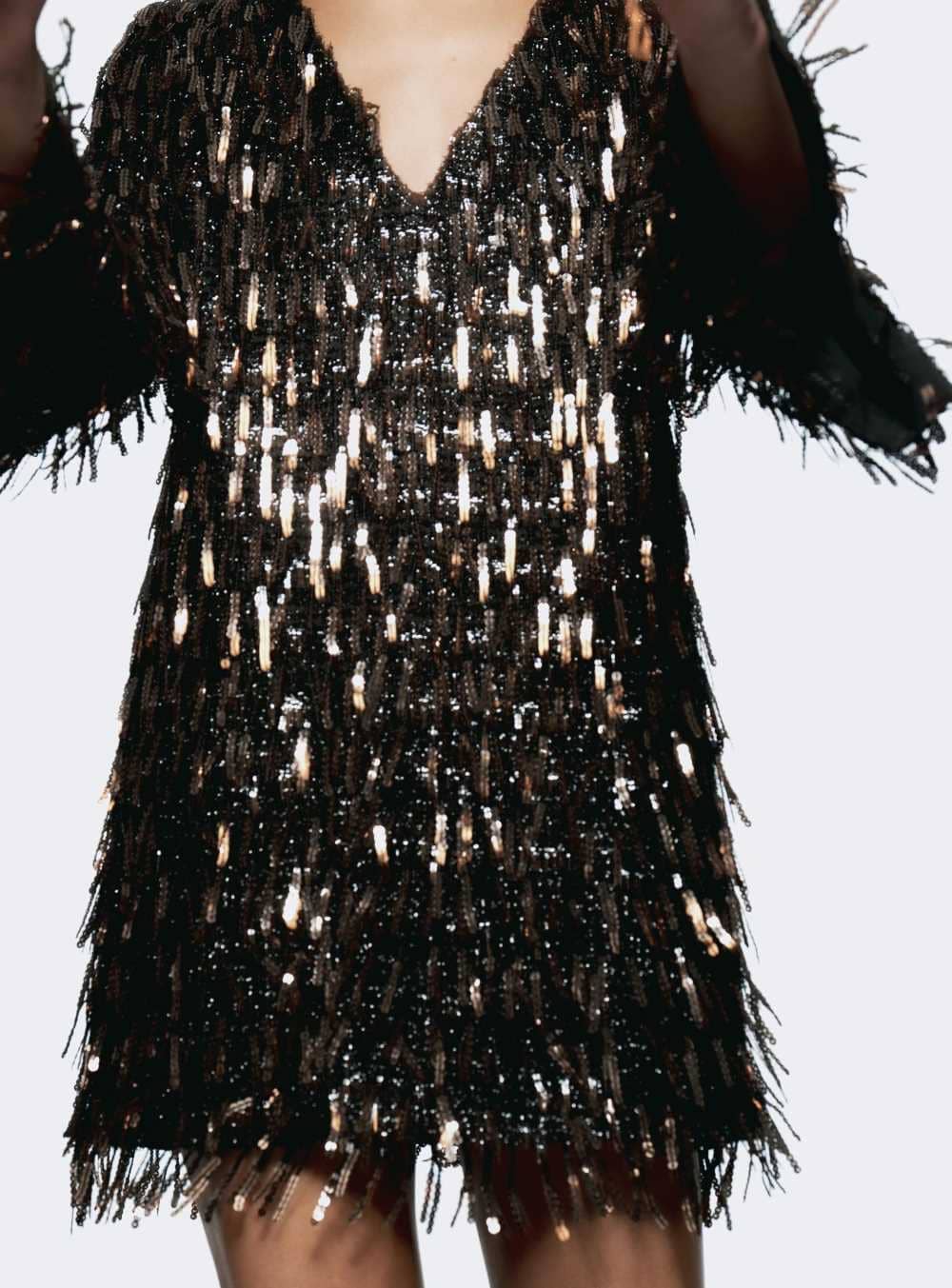 Vestido mini flecos lentejuelas de Zara