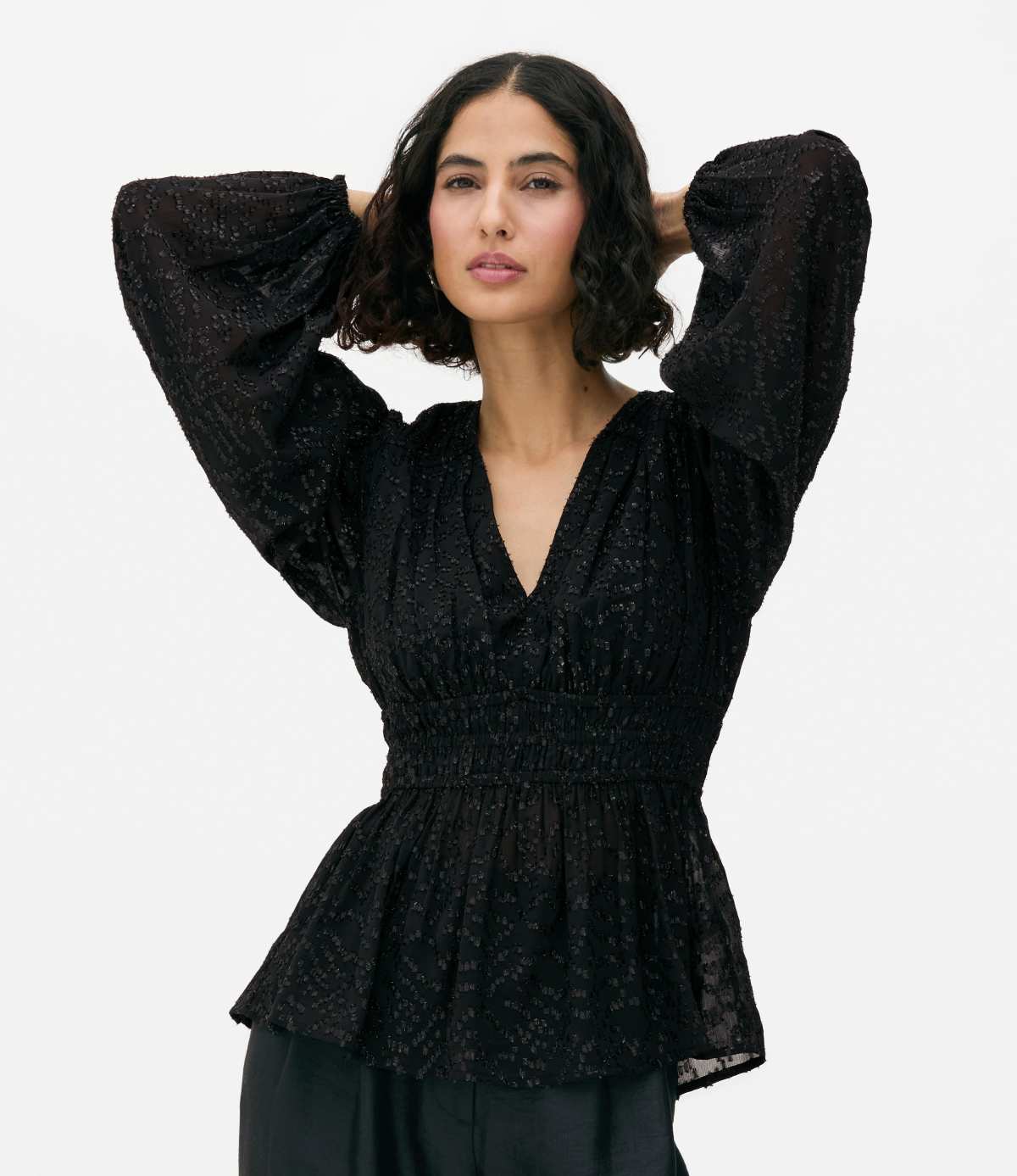 Blusa brillante con péplum de Primark