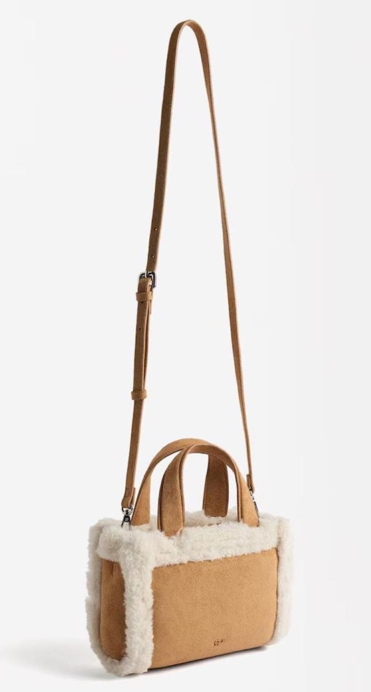 Bolso de mano estilo tote convertible a bandolera con pelito y cierre de cremallera