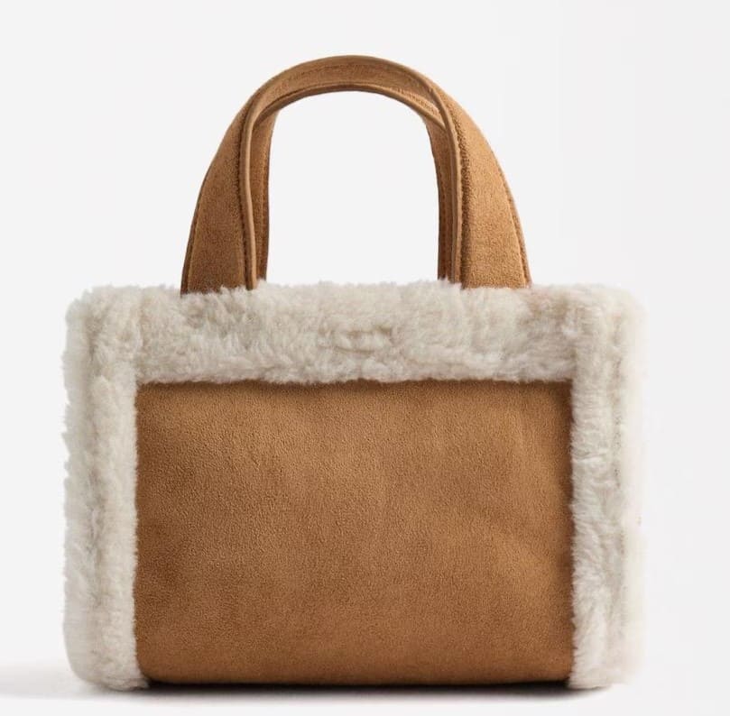Bolso de mano estilo tote convertible a bandolera con pelito y cierre de cremallera