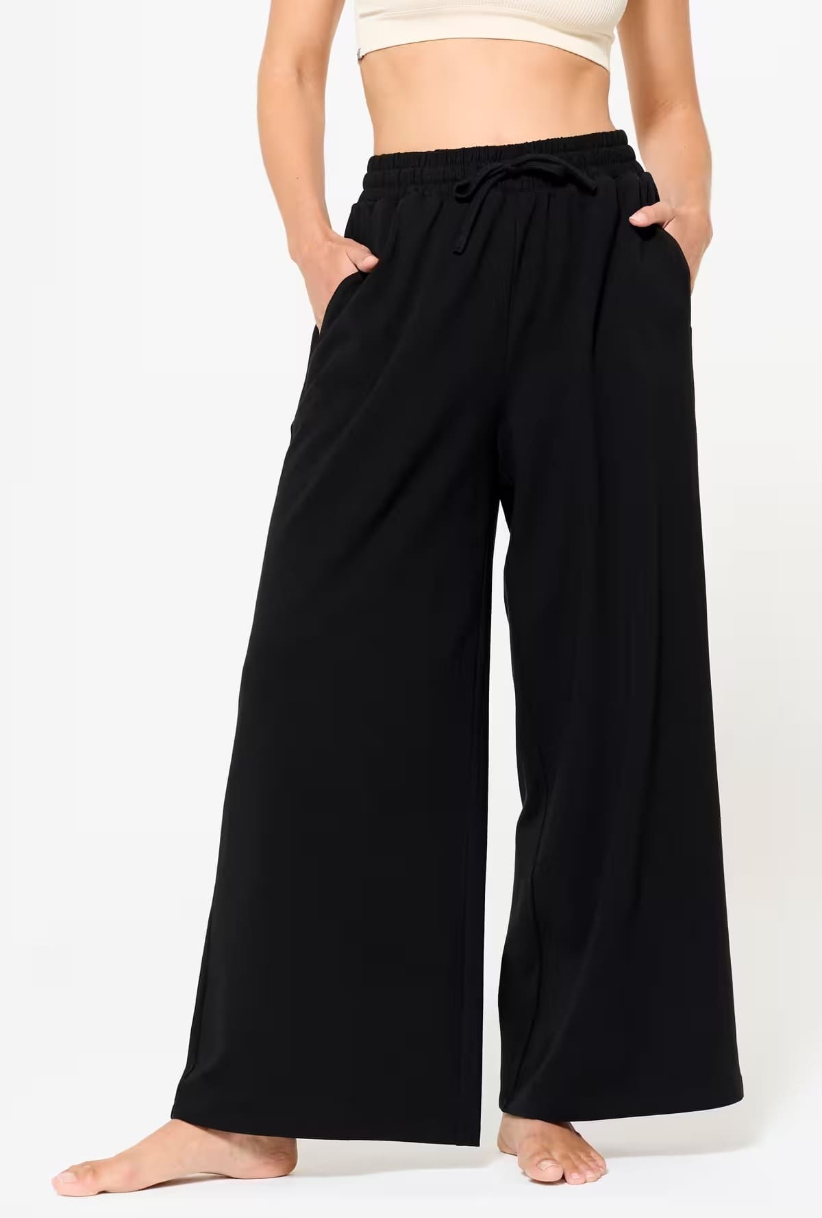 El pantalón flare fitness 520 para mujer negro de Domyos en Decathlon