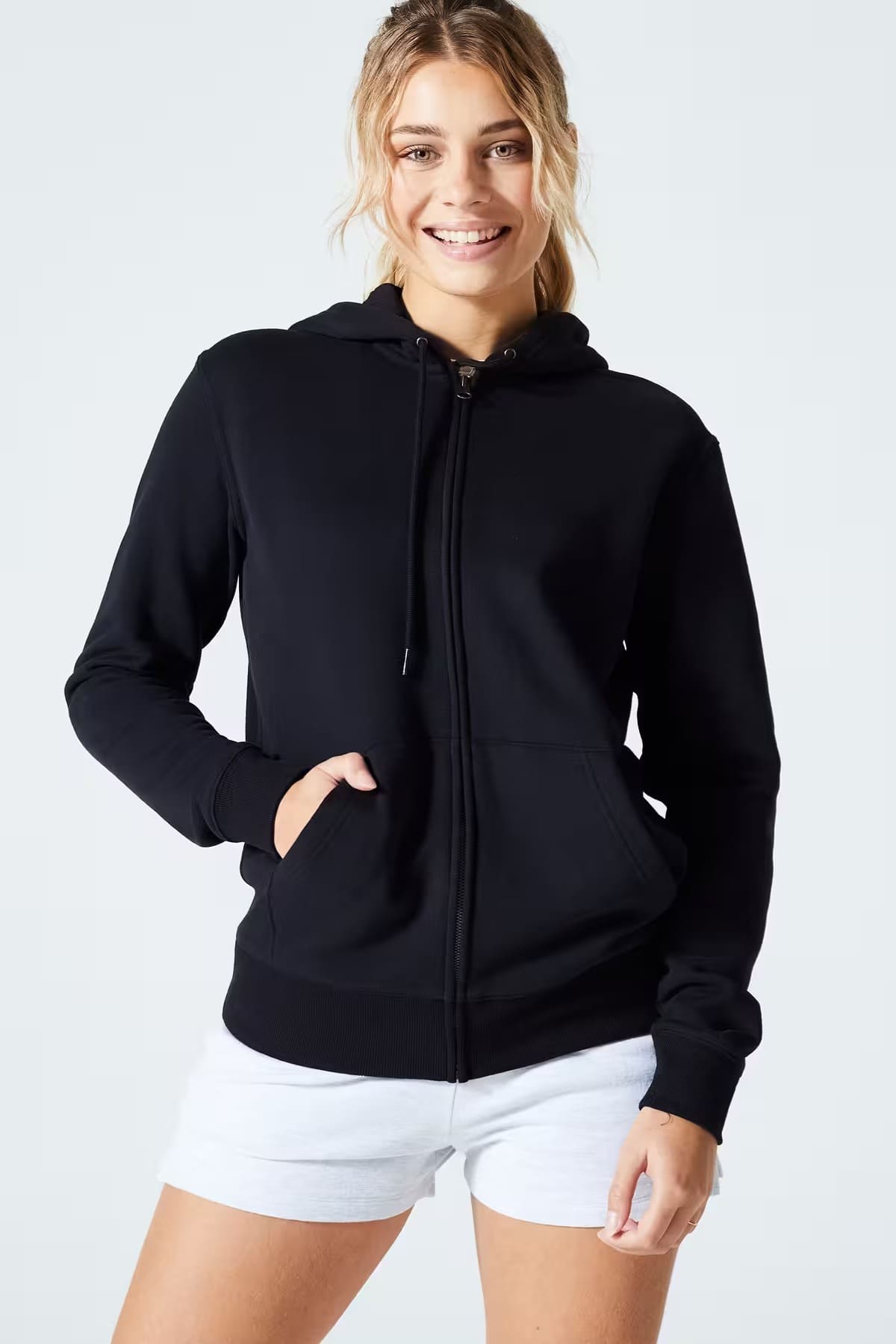 La chaqueta tipo sudadera Fitness para mujer negra con cremallera de Domyos en Decathlon
