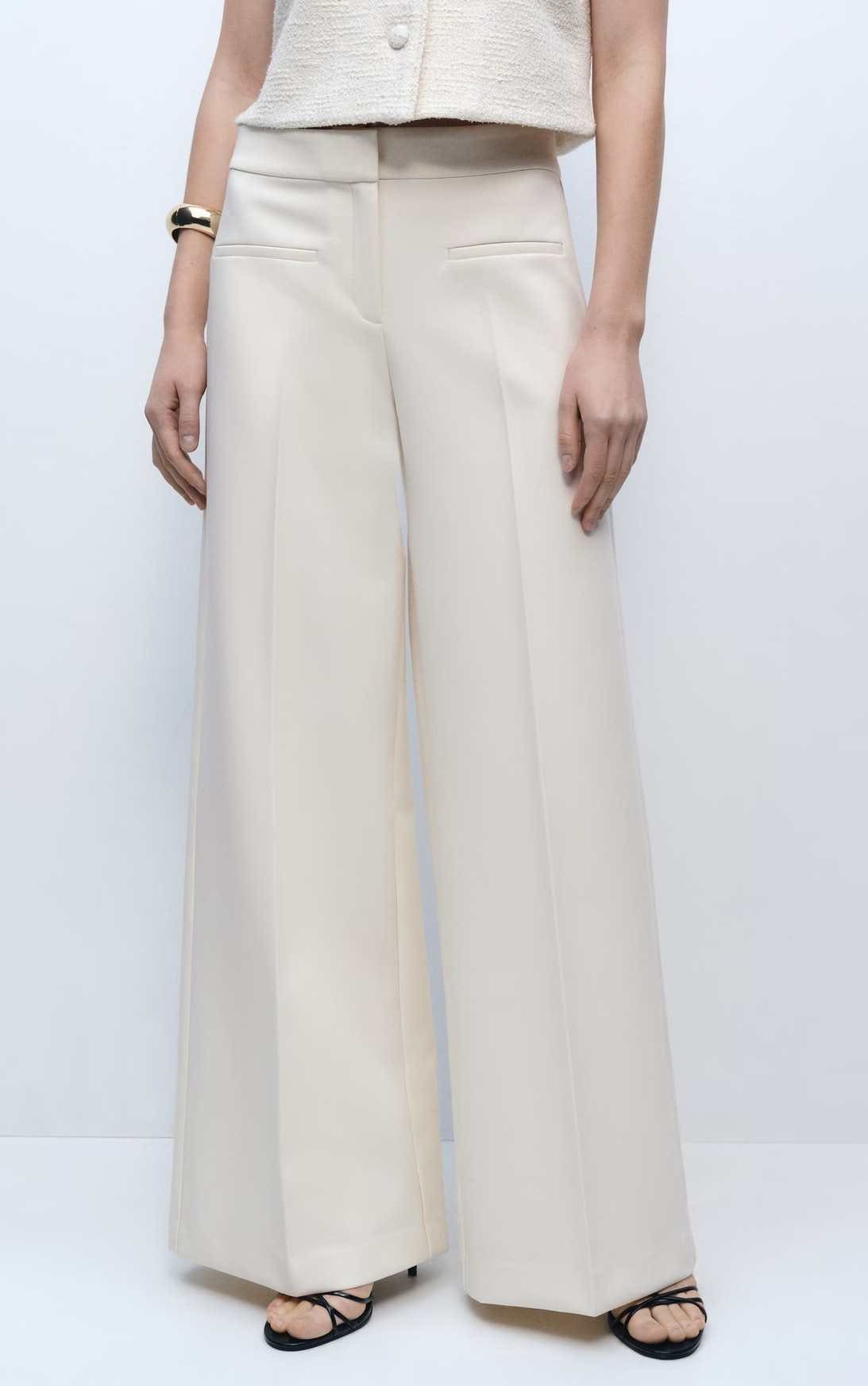 Pantalón wideleg tiro medio bolsillos de Mango