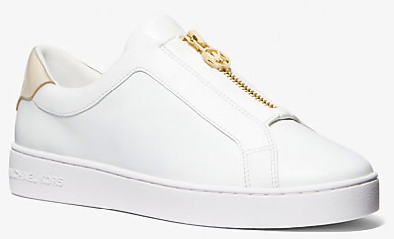 Las zapatillas Keaton de piel con cremallera en color dorado pálido de Michael Kors