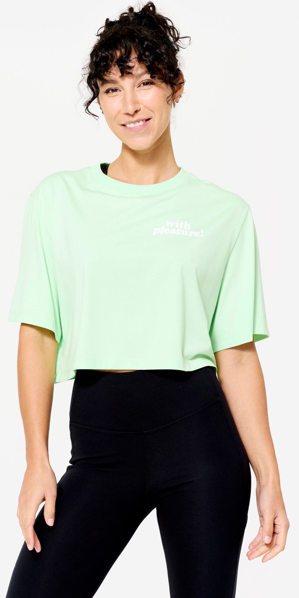 Camiseta crop top verde claro Domyos de Decathlon