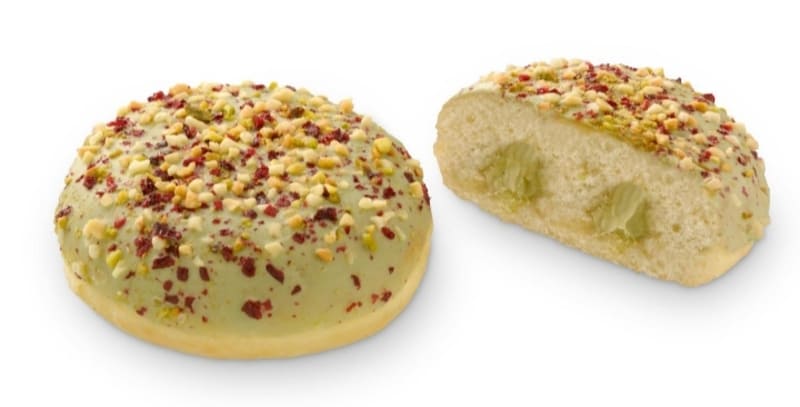 Berlina con cobertura y trozos de pistacho rellena de crema sabor pistacho