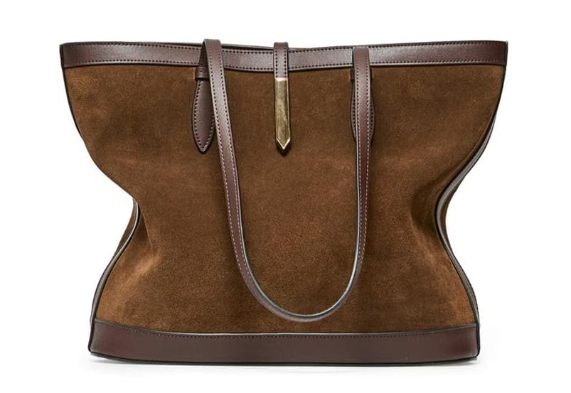 Bolso de piel con detalle decorativo de aplique