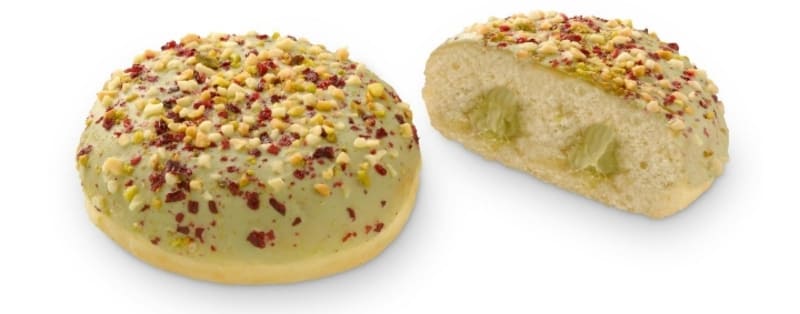 Berlina rellena de crema sabor pistacho con cobertura y trozos de pistacho