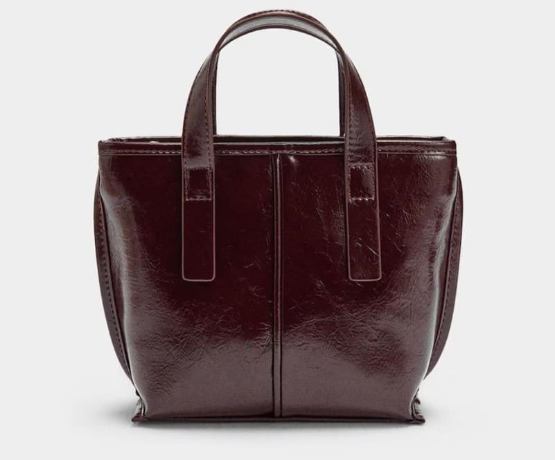 Bolso de mano estilo tote convertible a bandolera con cierre de cremallera en liso