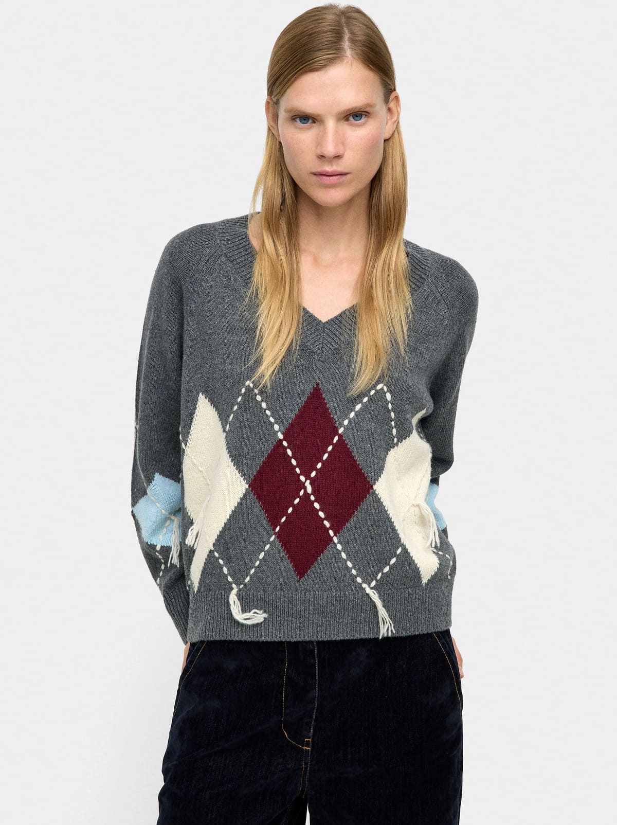 Jersey de punto con rombos y bordado