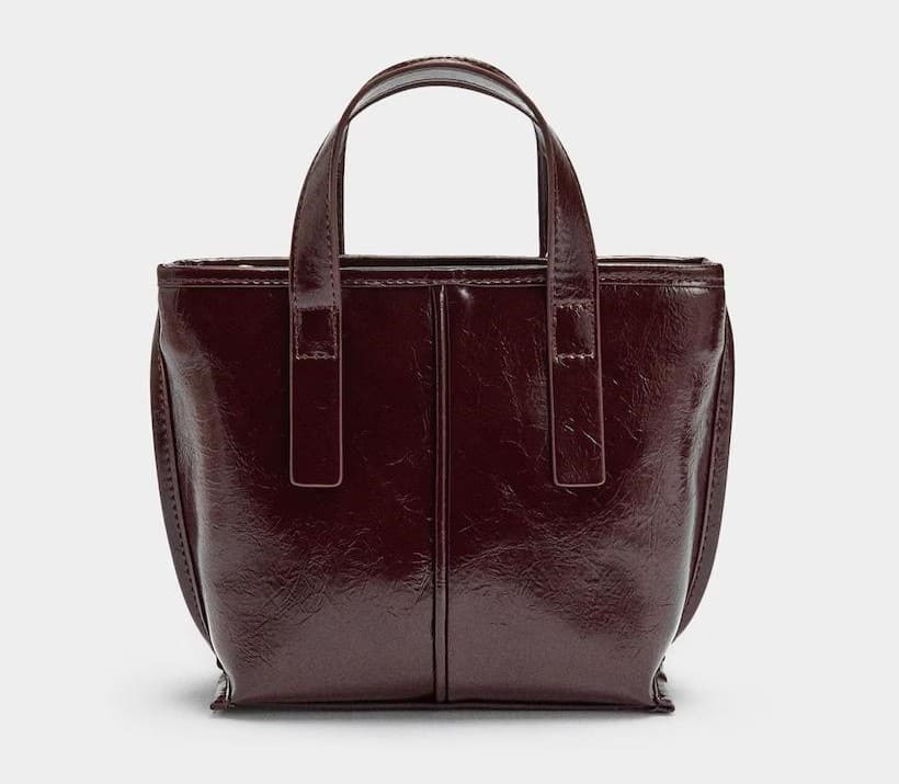 Bolso de mano estilo tote convertible a bandolera con cierre de cremallera en liso