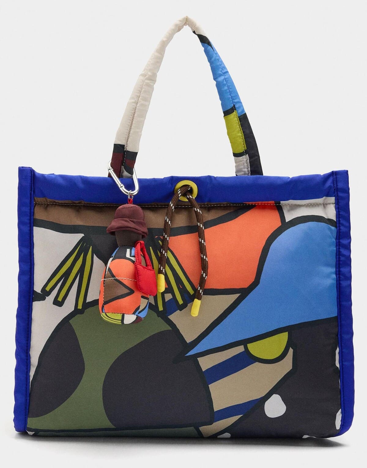 Bolso shopper convertible a bandolera con cierre de cremallera y estampados