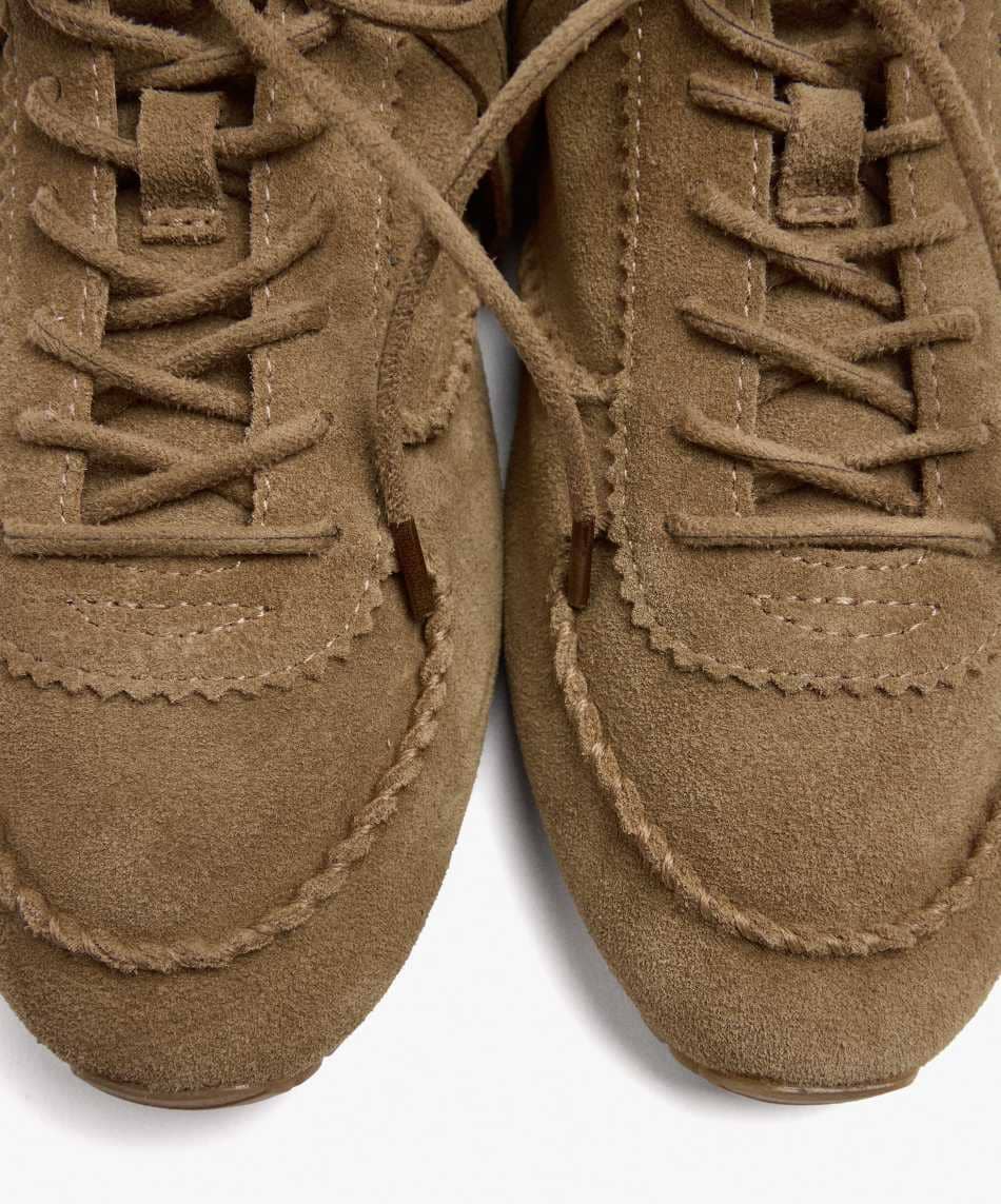 Zapatillas de piel con flecos de Parfois