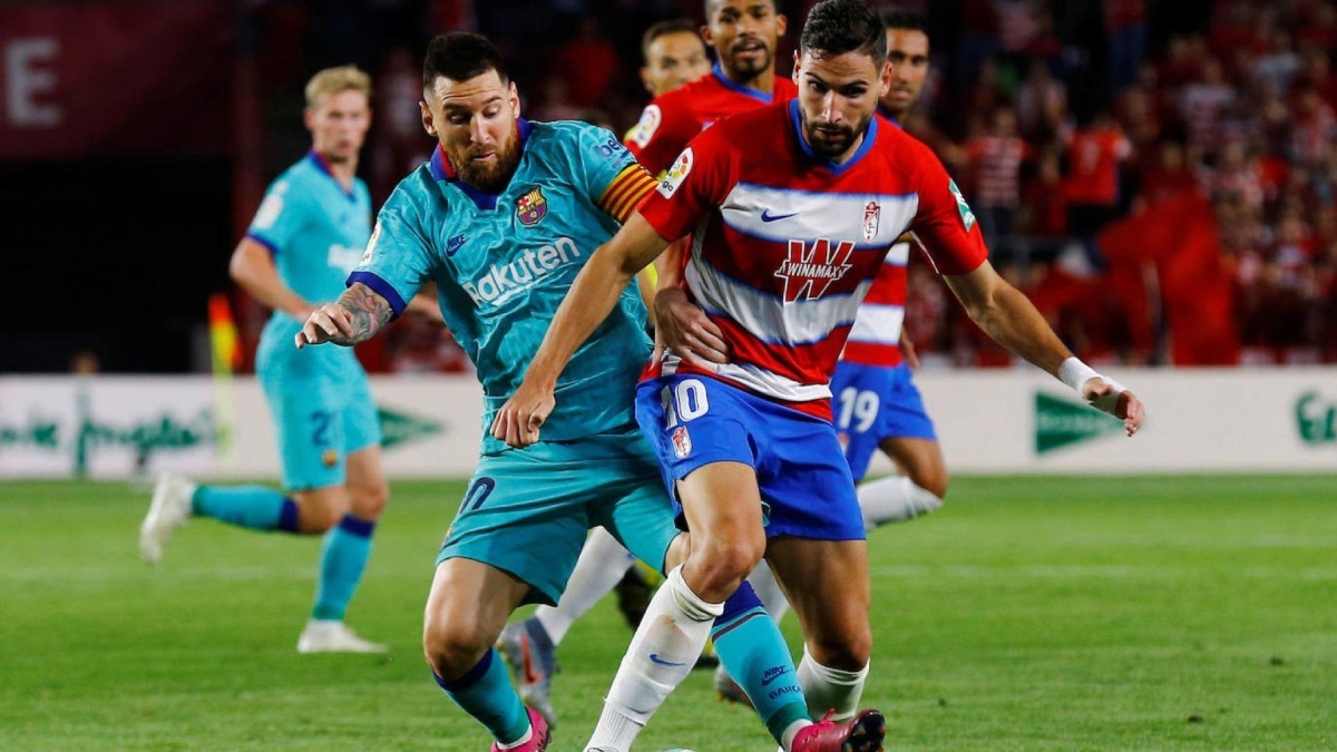 Antonio Puertas y Leo Messi en un Granada CF - FC Barcelona